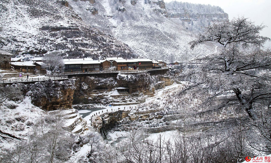 Hanging village on cliff after snow 