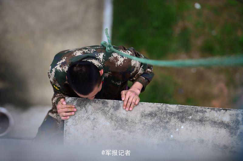 SWAT members run on the wet wall in training