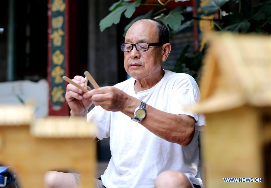 70-year-old makes handicrafts using discarded wooden sticks