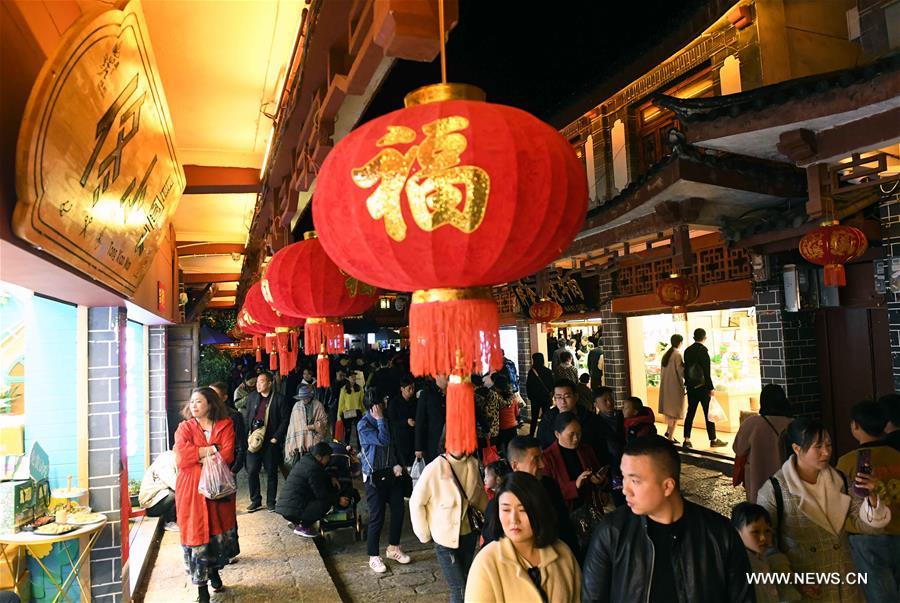 Tourists visit Lijiang ancient town in southwest China's Yunnan