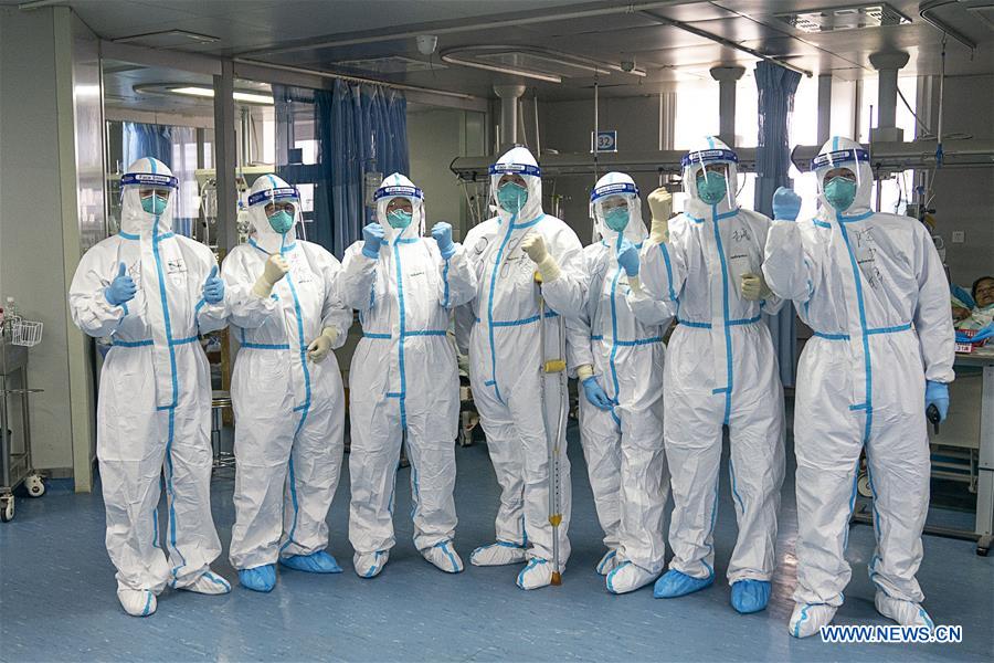 Medical workers take care of patients in Wuhan