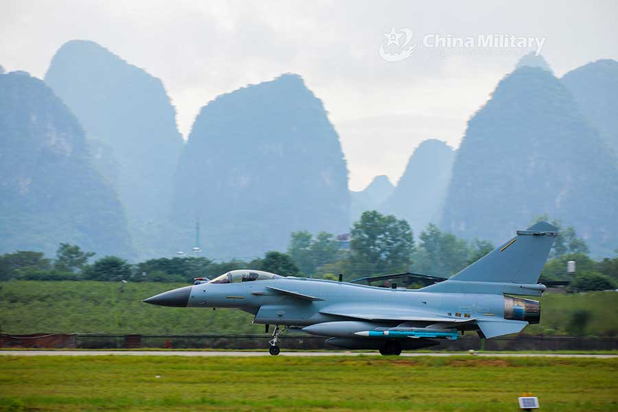 Fighter jets head for take-off on taxiway before flight