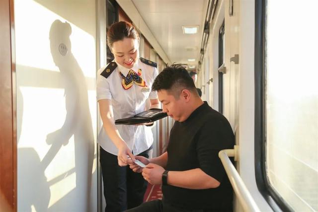 Attendants change uniforms six times as train moves southward