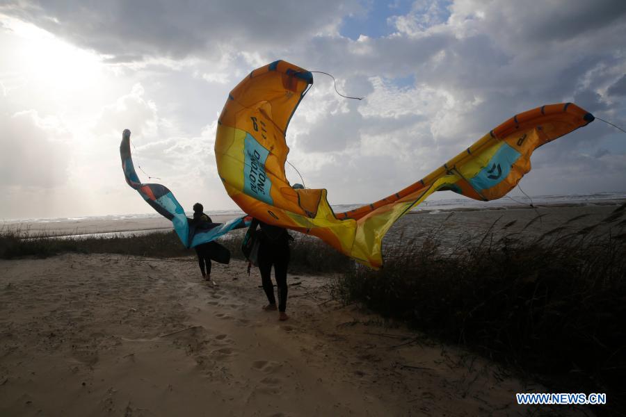 Israeli kite surfers practice on Mediterranean beach