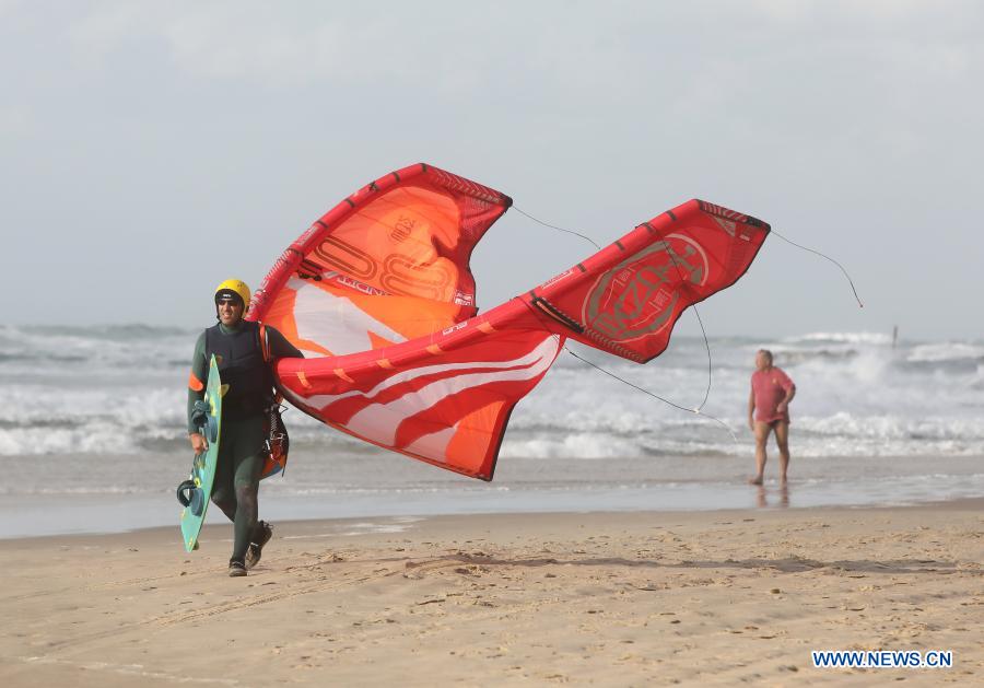 Israeli kite surfers practice on Mediterranean beach