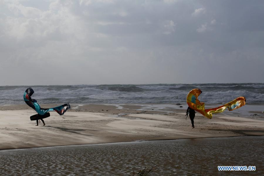 Israeli kite surfers practice on Mediterranean beach