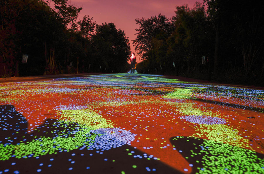 Fluorescent footpath glows under the night sky in Chongqing