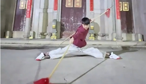 Young martial arts enthusiast showcases impressive spear skills