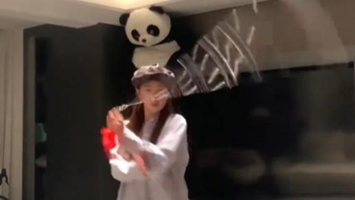 Young woman shows off nine-section whip skills