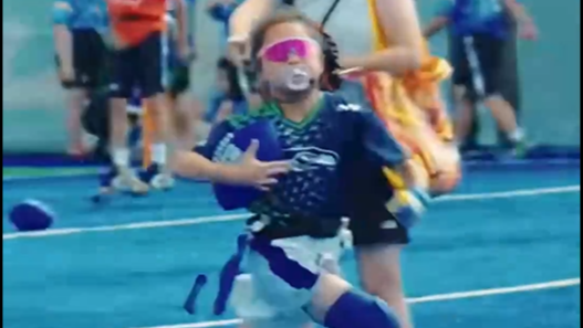 Girl in shades lights up football field with fearless run