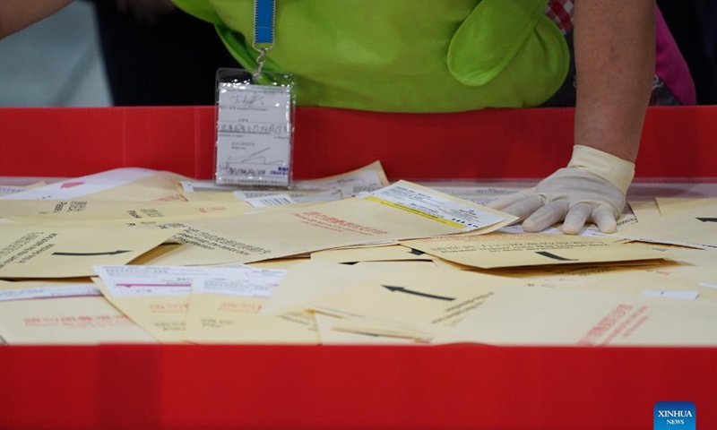 Staff members work at a counting station in Hong Kong, south China, Sept. 19, 2021. The voting of the 2021 Election Committee's subsector ordinary elections in China's Hong Kong Special Administrative Region (HKSAR) ran from 9:00 a.m. to 6:00 p.m. local time on Sunday. (Xinhua)