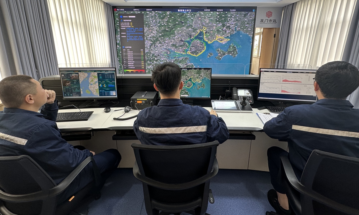 Staff members of Xiamen Municipal Marine Environmental Sanitation Management operate a remote sensing satellite system to detect environmental quality in Xiamen sea area, in East China's Fujian province, on January 25, 2024. Photo: Lin Xiaoyi/GT