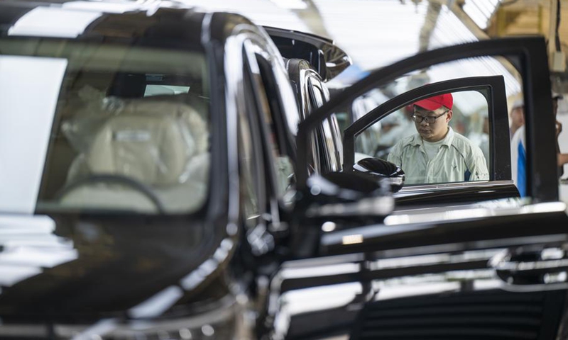 A worker works at an assembly line of Voyah, a Chinese NEV brand, in Wuhan, central China's Hubei Province, April 9, 2025. (Photo: Xinhua)