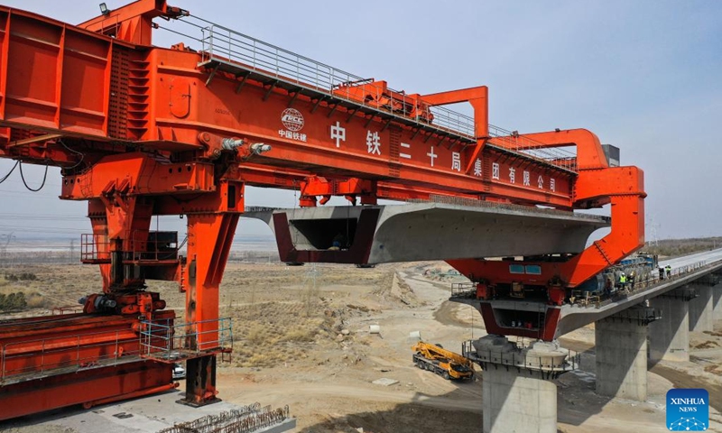A drone photo taken on March 6, 2025 shows the closed Heyuancun Grand Bridge of Baotou-Yinchuan High-speed Railway in north China's Inner Mongolia Autonomous Region. The Heyuancun Grand Bridge was successfully closed on Thursday, marking the completion of the bridges and tunnels within the Inner Mongolia section of Baotou-Yinchuan High-speed Railway, which links Baotou in Inner Mongolia and Yinchuan in northwest China's Ningxia Hui Autonomous Region. (Photo: Xinhua)