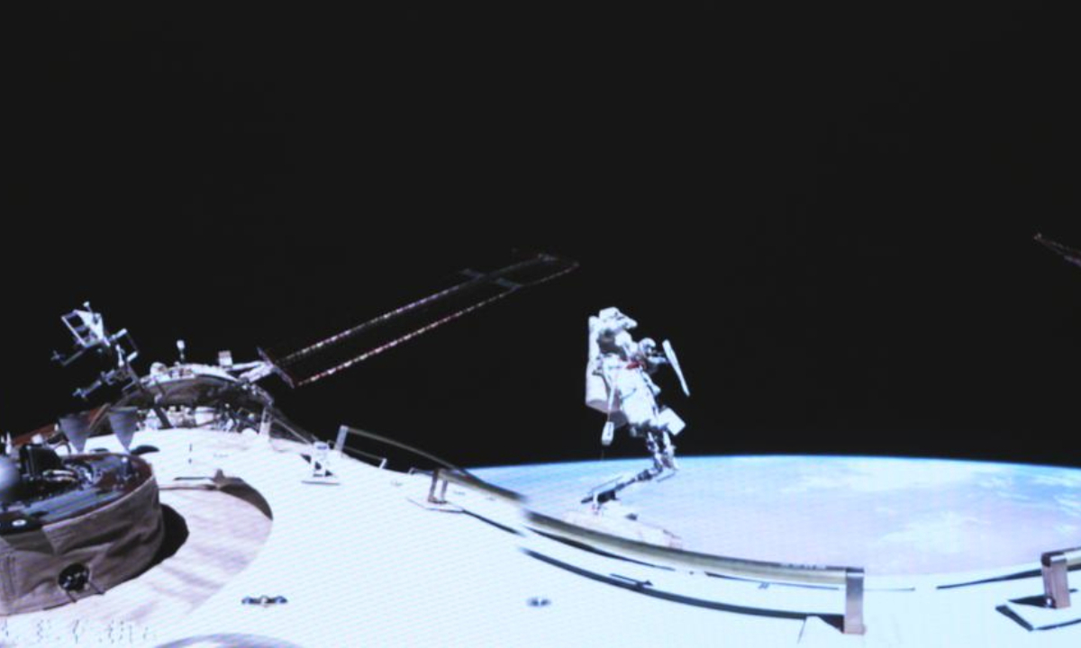 This screen image captured at Beijing Aerospace Control Center on Aug. 15, 2025 shows Shenzhou-20 astronaut Chen Dong performing extravehicular activities outside China's orbiting space station. The Shenzhou-20 crew aboard China's orbiting space station completed their mission's third series of extravehicular activities on Friday, according to the China Manned Space Agency (CMSA).(Xinhua/Li Yanchen)