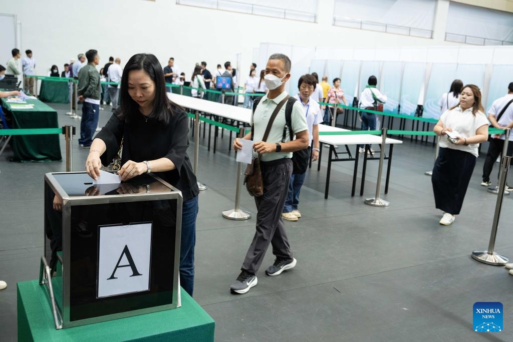 People queue to cast their ballots at a polling station in Macao, south China, Sept. 14, 2025. (Photo: Xinhua)